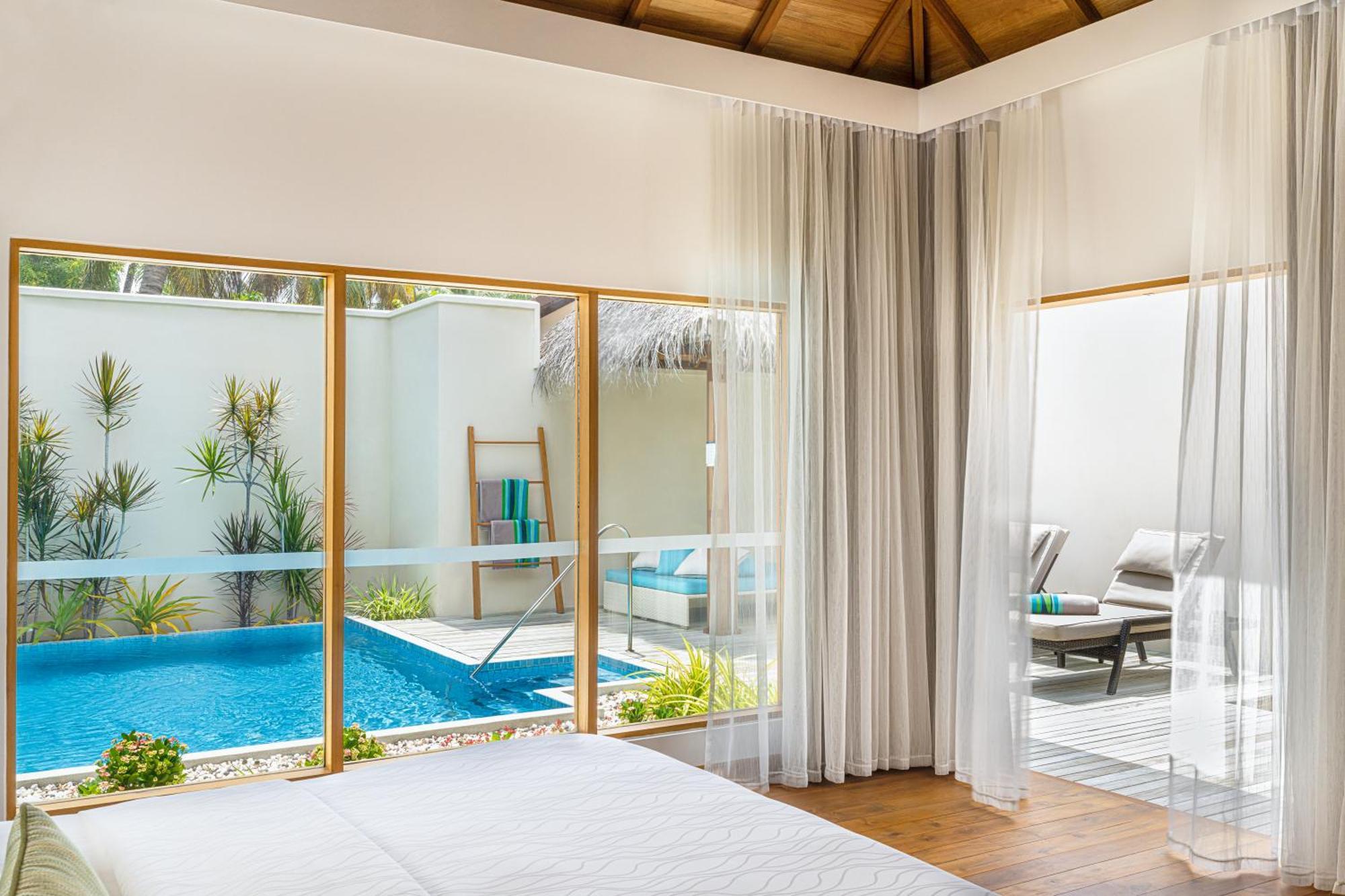 Kurumba Maldives Vihamanaafushi Exterior foto A bedroom at the resort